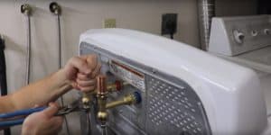 Reconnect the washing machine hoses